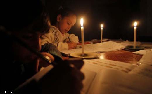 Kanak-kanak menyiapkan kerja sekolah hanya dengan bercahayakan lilin apabila bekalan elektrik terputus pada 27 Mac lalu